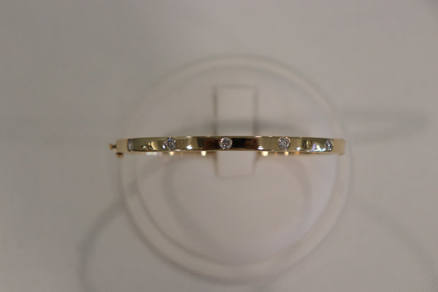 14Karat yellow gold round diamond bangle bracelet